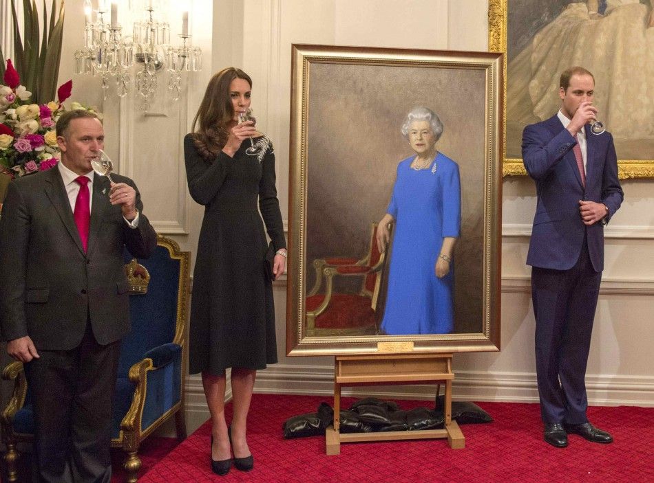 Britains Catherine, Duchess of Cambridge and her husband Prince William drink a toast after unveiling a portrait of Britains Queen Elizabeth as they attend a state reception at Government House in Wellington