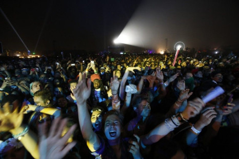 Concertgoers cheer during a performance by Pharrell Williams at the Coachella Valley Music and Arts Festival in Indio