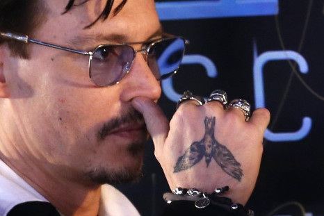  Actor Johnny Depp attends a red carpet event to promote his new movie &quot;Transcendence&quot;, on his first visit to China