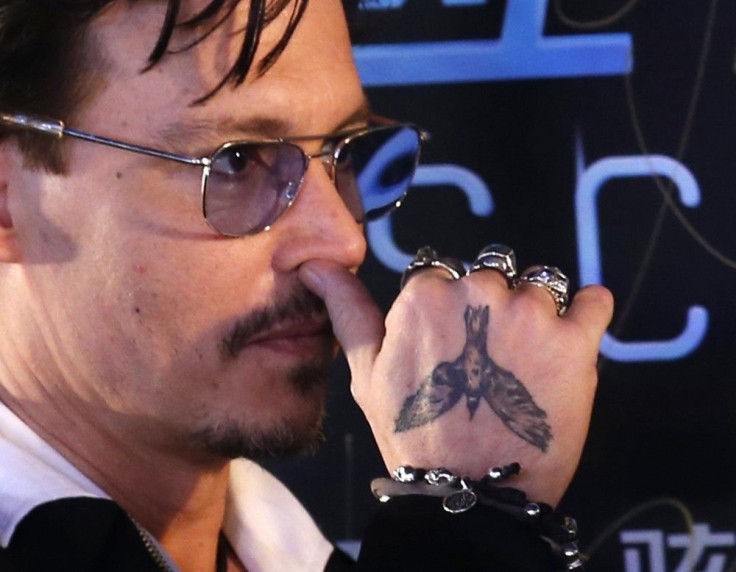  Actor Johnny Depp attends a red carpet event to promote his new movie &quot;Transcendence&quot;, on his first visit to China