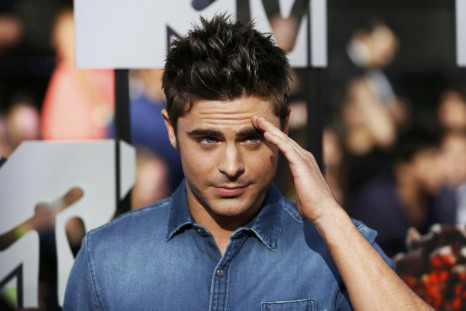 Zac Efron arrives at the 2014 MTV Movie Awards in Los Angeles