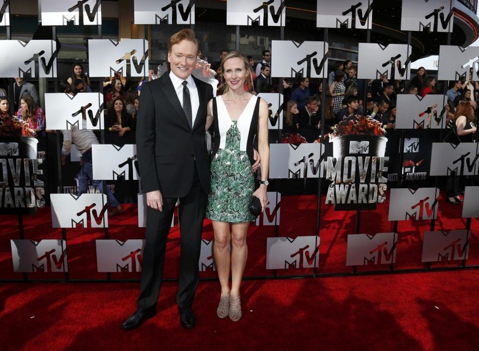 Show host Conan OBrien and his wife, Liza Powell, arrive at the 2014 MTV Movie Awards in Los Angeles