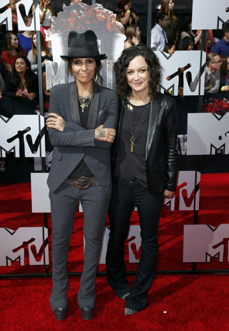 Linda Perry and Sara Gilbert arrive at the 2014 MTV Movie Awards in Los Angeles
