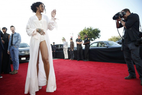 Singer Rihanna is photographed as she arrives at the 2014 MTV Movie Awards in Los Angeles, California  April 13, 2014.  REUTERS/Lucy Nicholson 