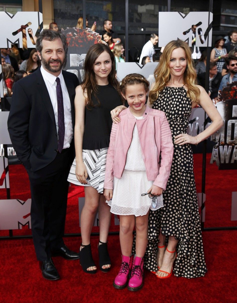 Judd Apatow poses with his wife, Leslie Mann and children Maude L and Iris as they arrive at the 2014 MTV Movie Awards in Los Angeles, California  April 13, 2014.  REUTERSDanny Moloshok  
