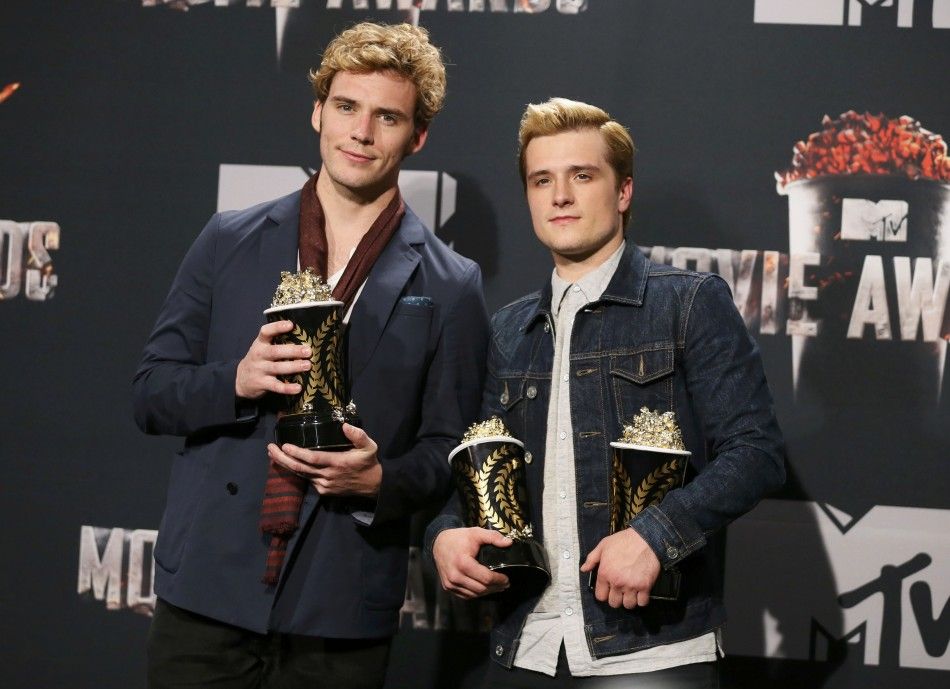 Sam Claflin and Josh Hutcherson pose backstage with their award for Best Movie of the Year and Hutchersons award for Best Male Performance for the film quotThe Hunger Games Catching Firequot at the 2014 MTV Movie Awards in Los Angeles