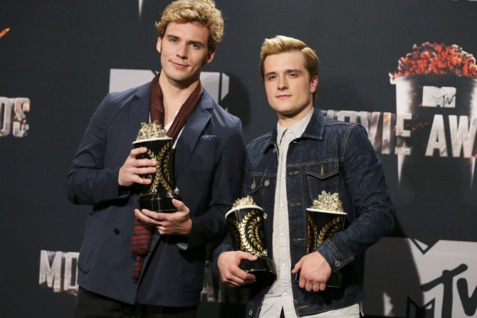 Sam Claflin and Josh Hutcherson pose backstage with their award for Best Movie of the Year and Hutcherson's award for Best Male Performance for the film &quot;The Hunger Games: Catching Fire&quot; at the 2014 MTV Movie Awards in Los Angeles