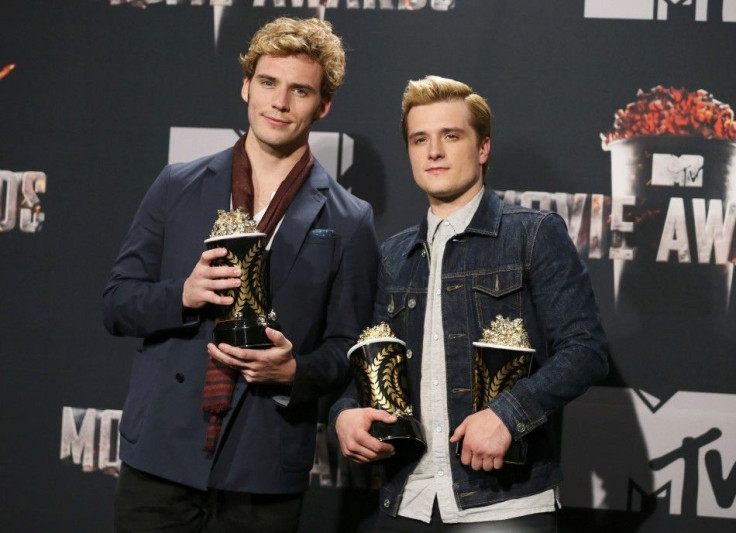 Sam Claflin and Josh Hutcherson pose backstage with their award for Best Movie of the Year and Hutcherson's award for Best Male Performance for the film &quot;The Hunger Games: Catching Fire&quot; at the 2014 MTV Movie Awards in Los Angeles