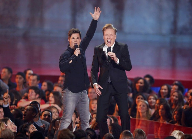Conan O'Brien performs a song with Adam DeVine at the 2014 MTV Movie Awards in Los Angeles