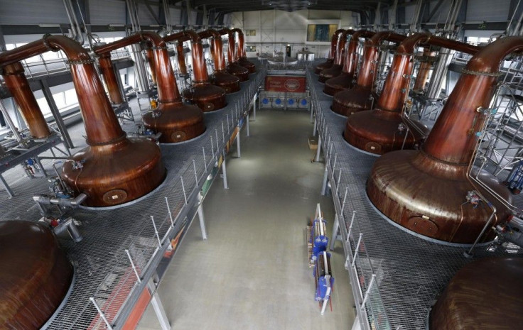 Copper pot stills are seen at the Diageo Roseisle distillery in Scotland March 20, 2014. Scotch whisky distillers are burning their unwanted grain byproducts, wood chips and other types of biomass for a source of energy in remote areas of the Highlands, w