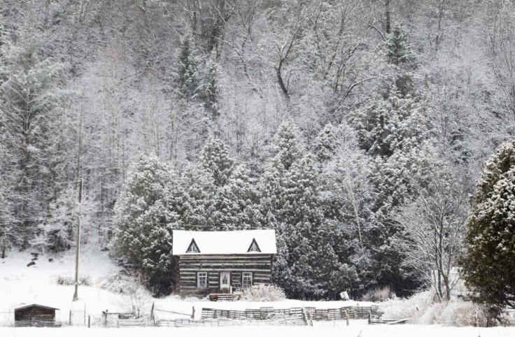 Snow covers a log cabin off Highway 36 in the City of Kawartha Lakes in central Ontario