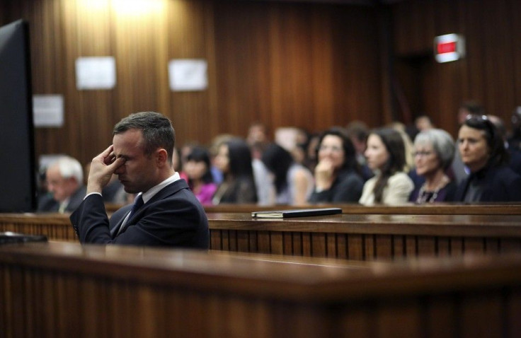 Olympic and Paralympic track star Oscar Pistorius reacts during his trial at North Gauteng High Court in Pretoria April 15, 2014. The prosecutor in the murder trial of Pistorius ended his five-day cross-examination of the double amputee track star on Tues