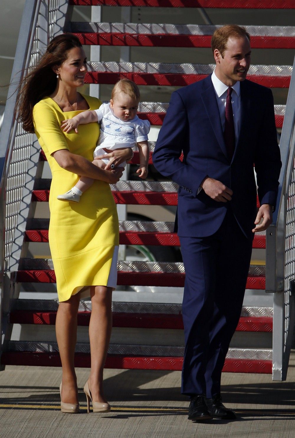 Britains Prince William And His Wife Catherine, The Duchess Of Cambridge, Arrive With Their Son Prince George At Sydney Airport April 16, 2014. 