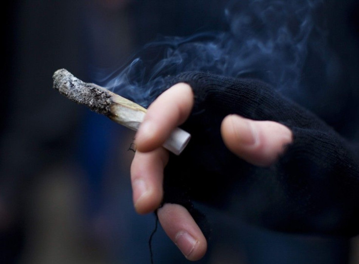 A young man smokes a marijuana joint at the Vancouver Art Gallery during the annual 4/20 day, which promotes the use of marijuana, in Vancouver, British Columbia in this file photo taken April 20, 2013. Young, casual marijuana smokers experience potential