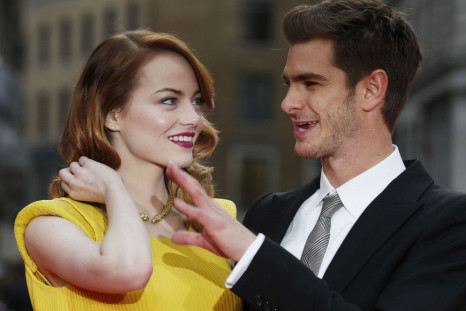 Actors Emma Stone and Andrew Garfield pose for photographs at the world premiere of The Amazing Spiderman 2 in central London, April 10, 2014.