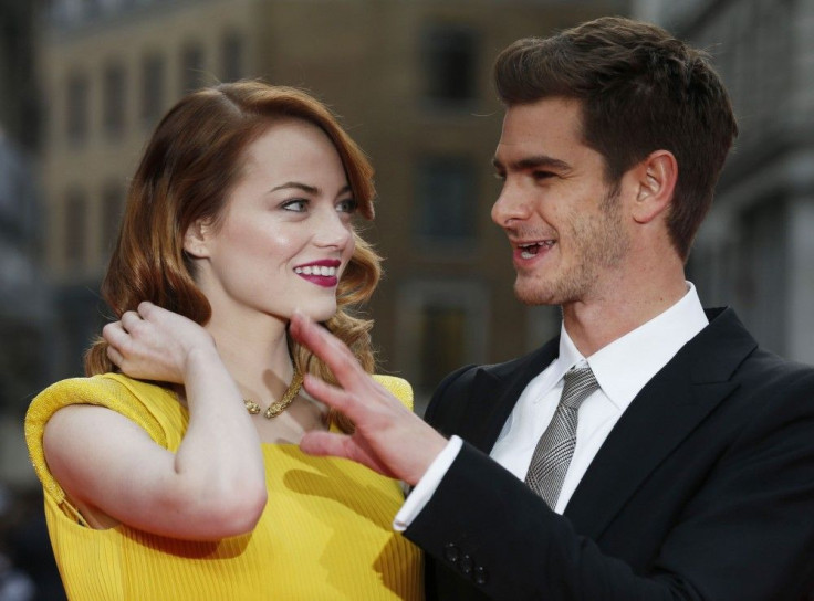 Actors Emma Stone and Andrew Garfield pose for photographs at the world premiere of The Amazing Spiderman 2 in central London, April 10, 2014.