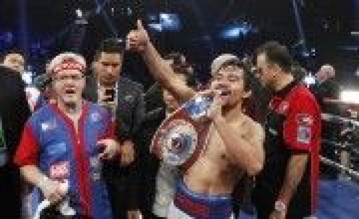 Pacquiao of the Philippines Celebrates His Victory Over Bradley of the U.S. After Their Title Fight at the MGM Grand Garden Arena in Las Vegas