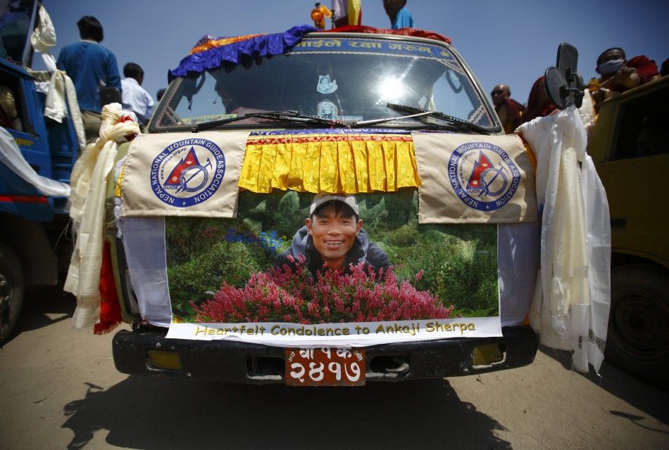 A portrait of Ankaji Sherpa, who lost his life in an avalanche in Mount Everest last Friday, is seen on a truck carrying his body during a funeral rally of Nepali Sherpa climbers in Kathmandu April 21, 2014. Nepals Sherpas have demanded compensation of 