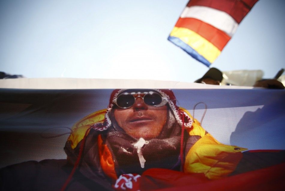 A portrait of Dorjee Khatri, who lost his life in an avalanche at Mount Everest last Friday, is seen on the truck carrying his body during the funeral rally of Nepali Sherpa climbers in Kathmandu April 21, 2014. Nepals Sherpas have demanded compensation 