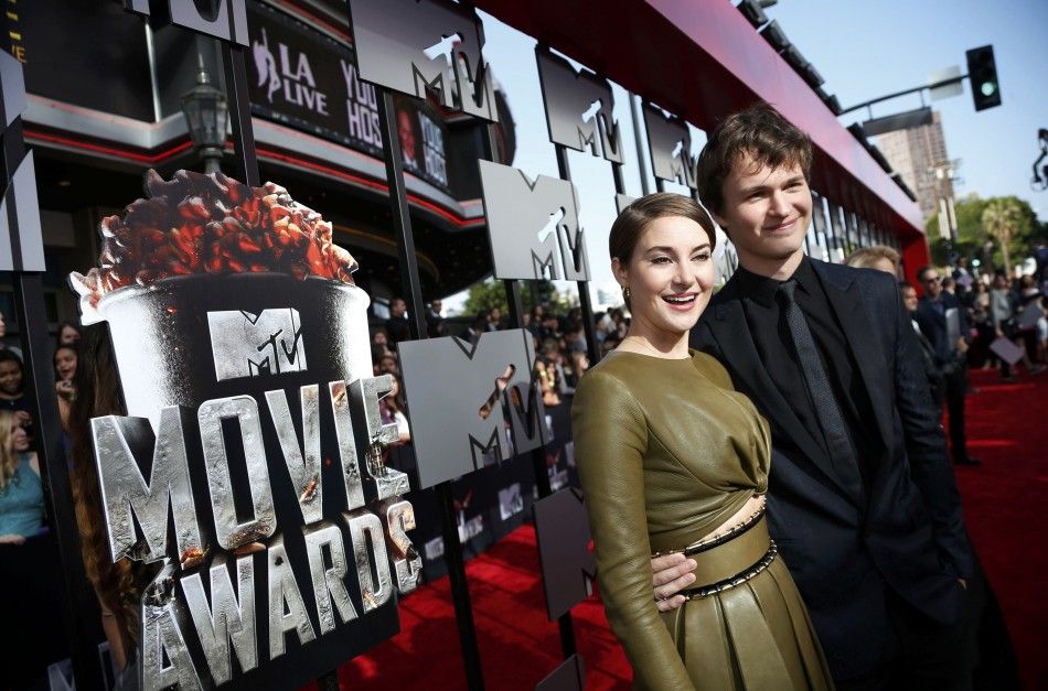 Actress Shailene Woodley and Ansel Elgort pose together as they arrive at the 2014 MTV Movie Awards in Los Angeles, California  April 13, 2014.  REUTERSLucy Nicholson 