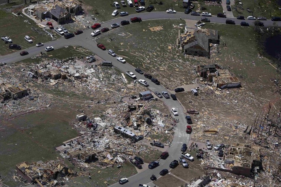 A residential neighborhood is seen destroyed by a tornado in this aerial photograph taken near Vilonia, Arkansas April 28, 2014. A ferocious storm system caused a twister in Mississippi and threatened tens of millions of people across the U.S. Southeast o