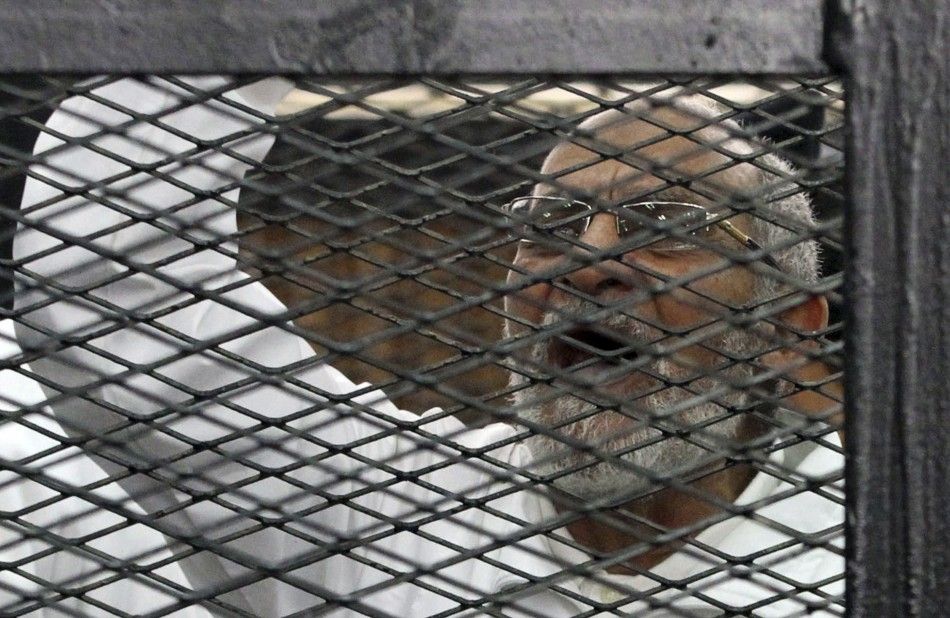 Muslim Brotherhood leader Mohammed Badie shouts slogans from the defendants cage during his trial with other leaders of the Brotherhood in a courtroom in Cairo December 11, 2013. REUTERSStringer