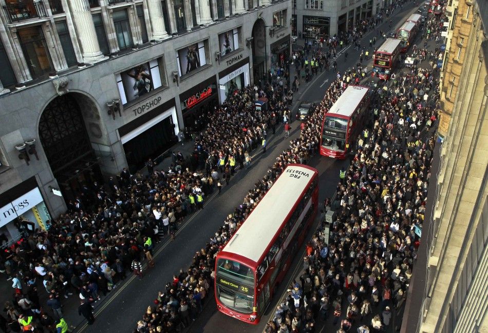 Crowds line the street waiting for model Kate Moss to launch her 15th Kate Moss Topshop collection at Topshops flagship store on Oxford Street in London