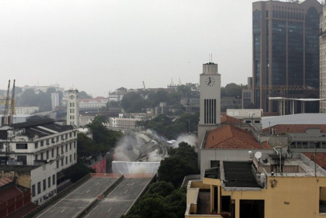 Explosives are detonated to demolish part of the Perimetral overpass, as part of Rio's Porto Maravilha (Marvelous Port) urbanisation project, in Rio de Janeiro April 20, 2014. The project is for the city's redevelopment ahead of the 2016 Olympic Games. RE