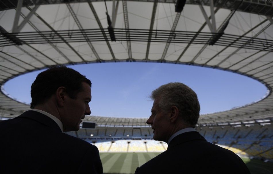 Britains Chancellor of the Exchequer George Osborne L talks with the CEO of the London Organising Committee of the Olympic and Paralympic Games LOCOG Paul Deighton during a visit to the Maracana Stadium in Rio de Janeiro, April 7, 2014. REUTERSRicar