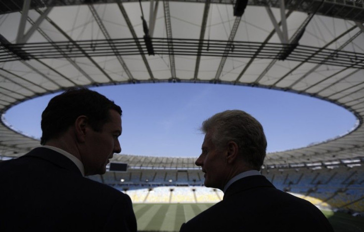 Britain's Chancellor of the Exchequer George Osborne (L) talks with the CEO of the London Organising Committee of the Olympic and Paralympic Games (LOCOG) Paul Deighton during a visit to the Maracana Stadium in Rio de Janeiro, April 7, 2014. REUTERS/Ricar
