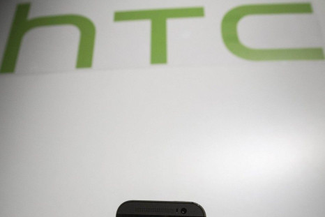 HTC CEO Peter Chou shows the new HTC One M8 phone during a launch event in New York March 25, 2014.