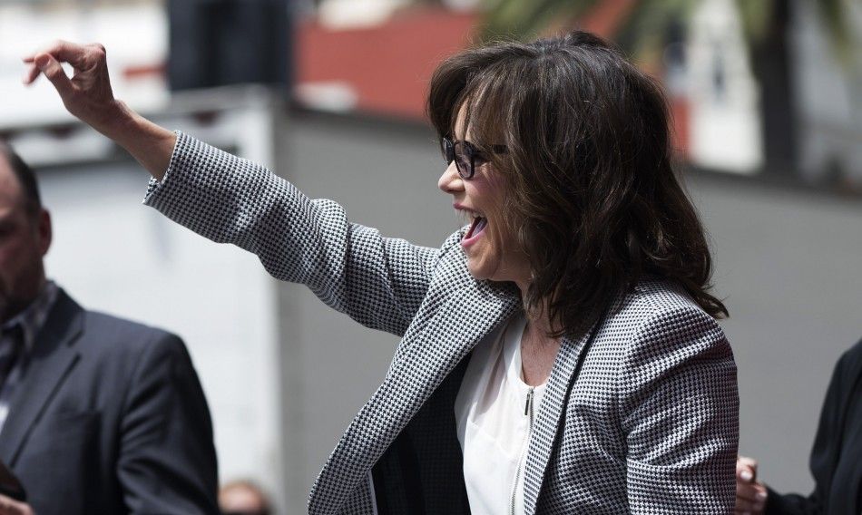 Actress Sally Field waves at fans as she arrives at the ceremony for the unveiling of her star on the Walk of Fame in Hollywood