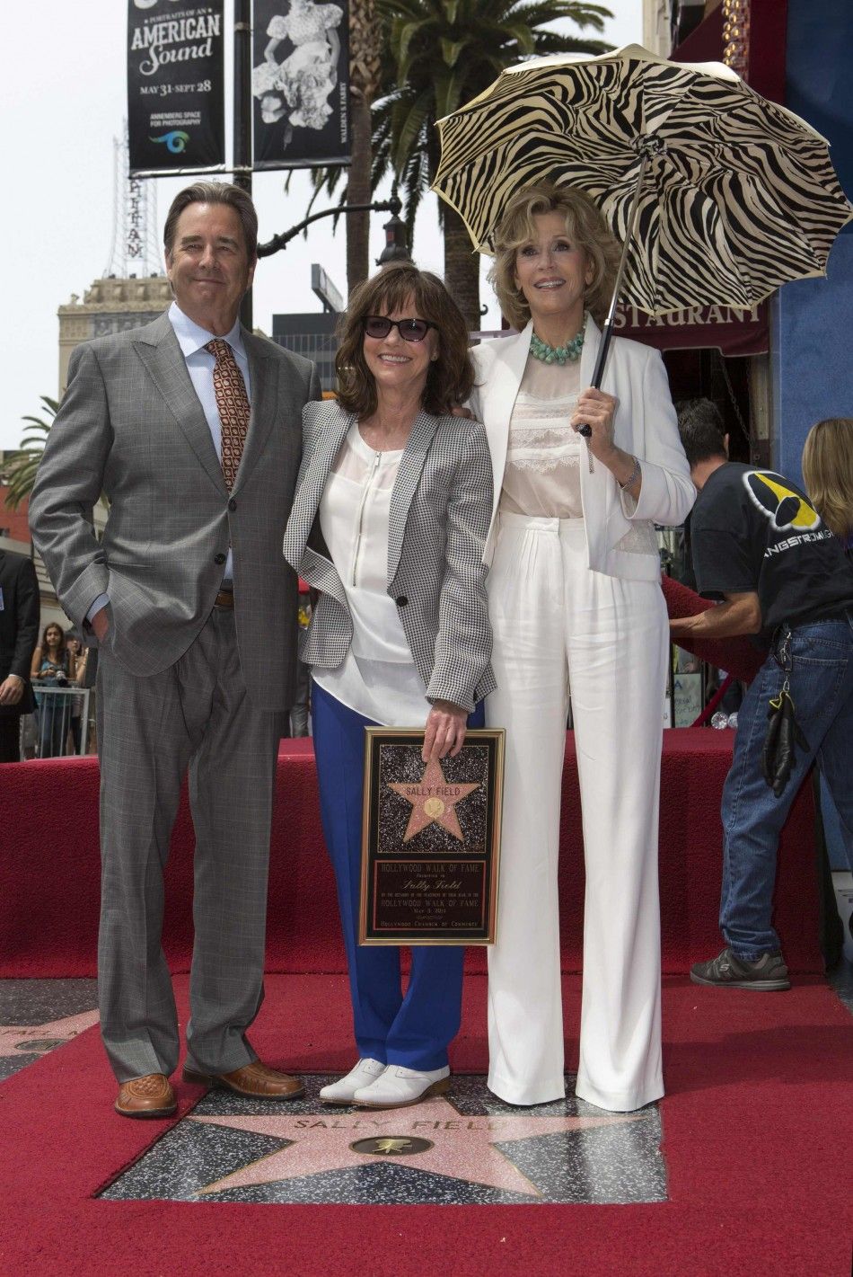 Actress Sally Field poses with actors Beau Bridges and Jane Fonda on her star after it was unveiled on the Walk of Fame in Hollywood