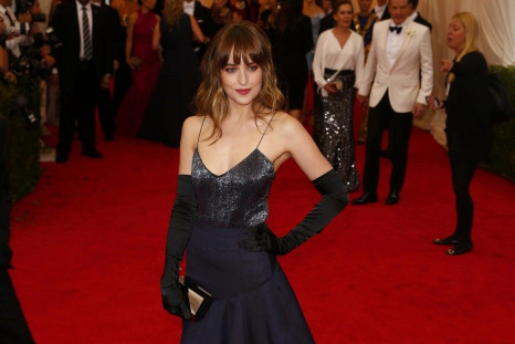 Actress Dakota Johnson arrives at the Metropolitan Museum of Art Costume Institute Gala Benefit celebrating the opening of &quot;Charles James: Beyond Fashion&quot; in Upper Manhattan, New York, May 5, 2014.  REUTERS/Lucas Jackson 