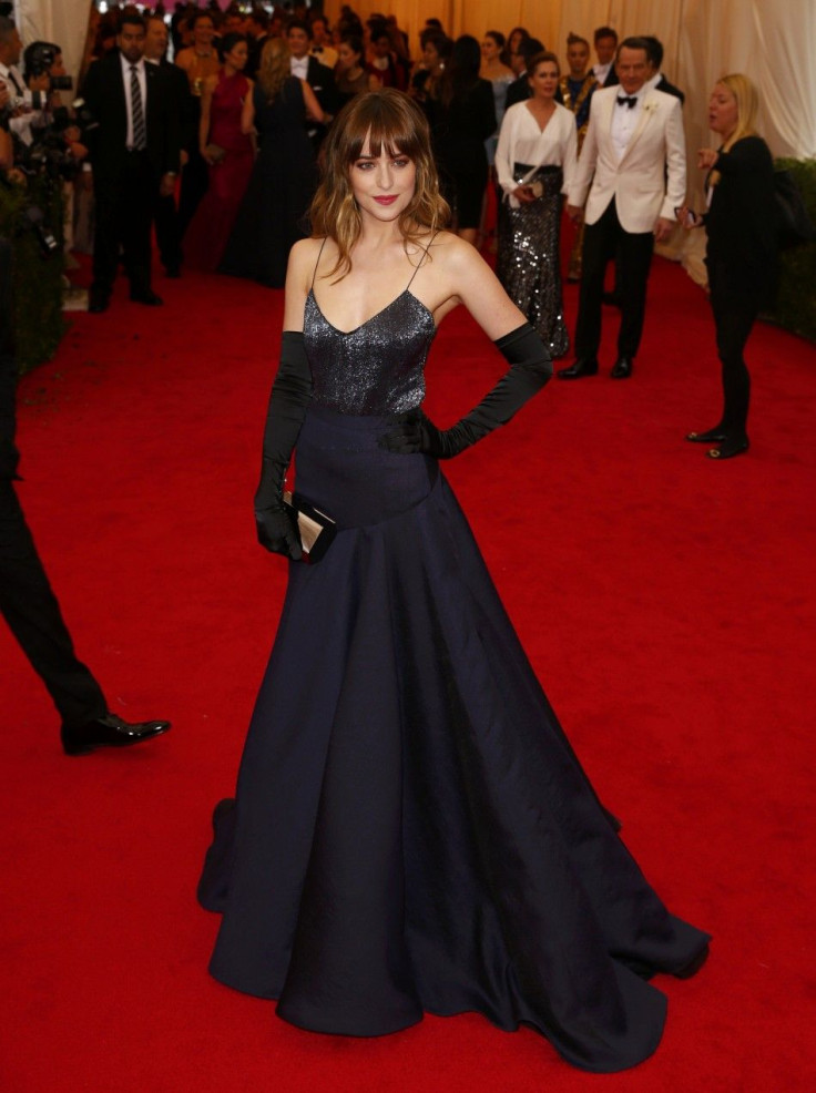 Actress Dakota Johnson arrives at the Metropolitan Museum of Art Costume Institute Gala Benefit celebrating the opening of &quot;Charles James: Beyond Fashion&quot; in Upper Manhattan, New York, May 5, 2014.  REUTERS/Lucas Jackson 
