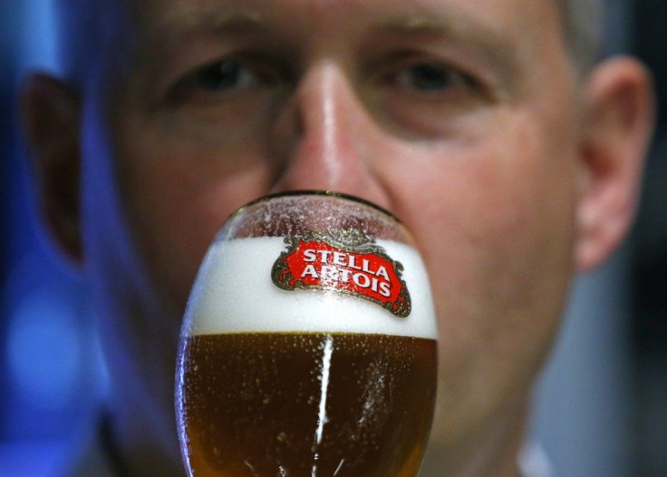 A waiter tastes a beer ahead of an Anheuser-Busch InBev shareholders meeting in Brussels April 30, 2014.