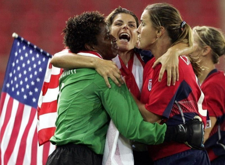 U.S. womens soccer players Briana Scurry (L) Mia Hamm and Brandi Chastain celebrate after beating Brazil.