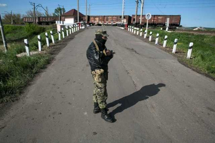 Both Sides Bury Dead as Ukraine Slides Towards War