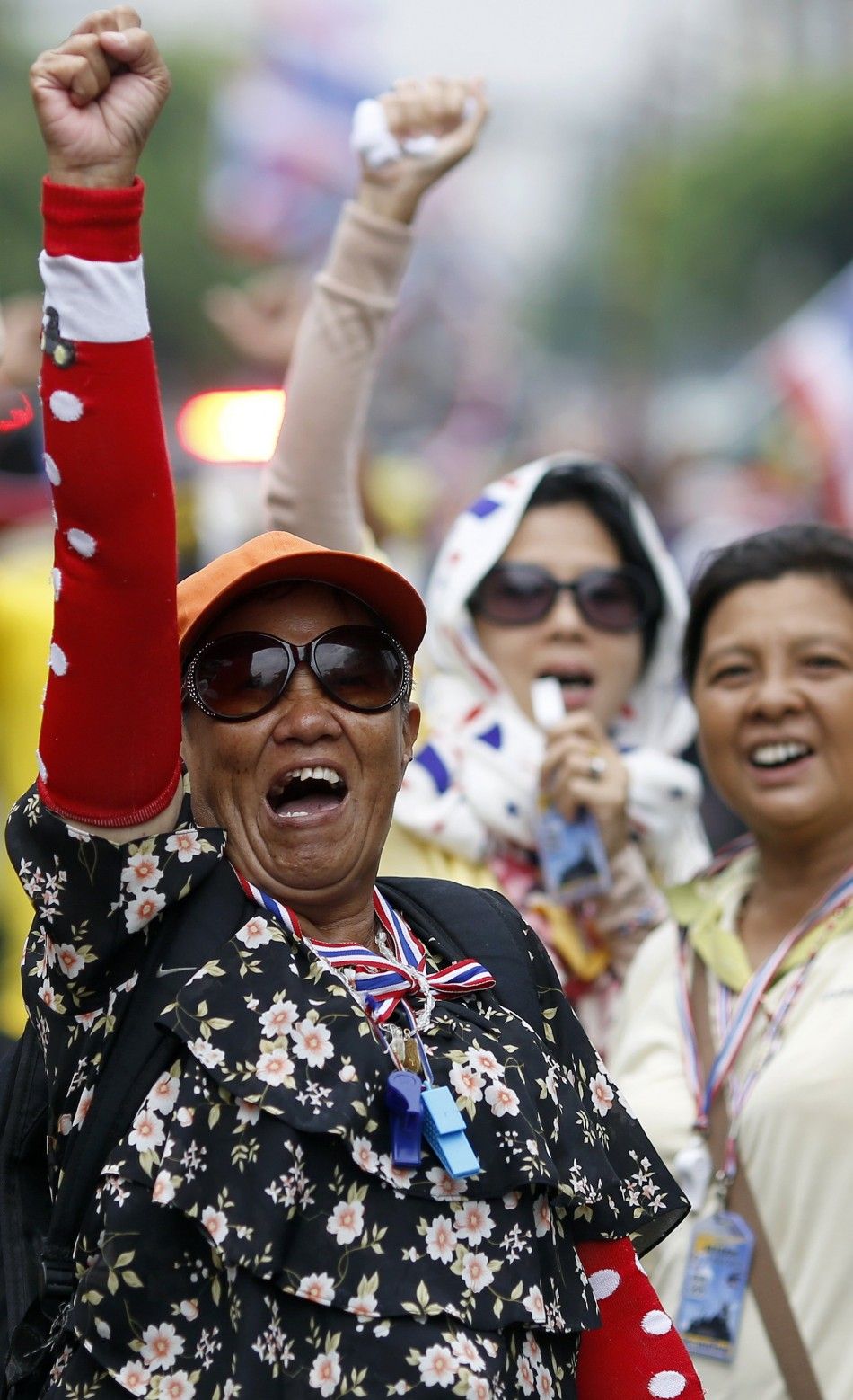 Anti-government protesters marching in the city centre celebrate shortly after a Thai court delivered its verdict on Prime Minister Yingluck Shinawatra, in Bangkok May 7, 2014. The Thai court found Yingluck guilty on Wednesday of violating the constitutio