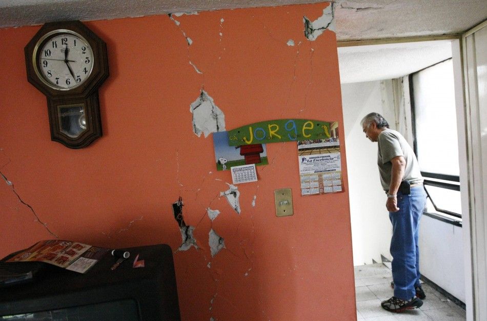 A man inspects the damage in his apartment following an earthquake in Mexico City April 18, 2014. The magnitude 7.2 quake was centred in the south-western state of Guerrero, close to the Pacific beach resort of Acapulco, the U.S. Geological Survey USGS 
