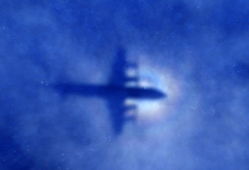 The shadow of a Royal New Zealand Air Force RNZAF P3 Orion maritime search aircraft can be seen on low-level clouds as it flies over the southern Indian Ocean looking for missing Malaysian Airlines flight MH370 March 31, 2014. REUTERSRob GriffithPool