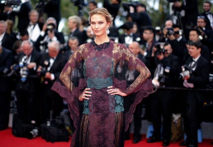 Model Karlie Kloss poses on the red carpet as she arrives for the opening ceremony of the 67th Cannes Film Festival in Cannes
