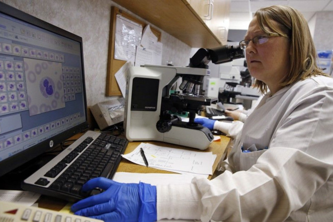 Shay Wilinski works in the Microbiology Lab at Community Hospital, where a patient with the first confirmed U.S. case of Middle East Respiratory Syndrome is in isolation, in Munster, Indiana, May 5, 2014. REUTERS/Jim Young