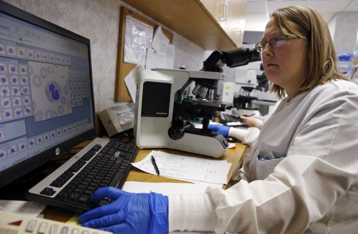 Shay Wilinski works in the Microbiology Lab at Community Hospital, where a patient with the first confirmed U.S. case of Middle East Respiratory Syndrome is in isolation, in Munster, Indiana, May 5, 2014. REUTERS/Jim Young