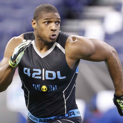 University of Missouri defensive end Michael Sam runs through drills during the 2014 NFL Combine in Indianapolis