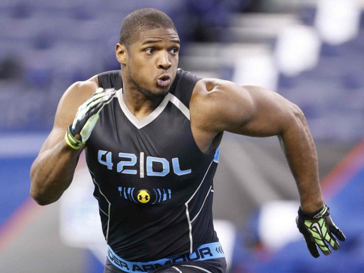 University of Missouri defensive end Michael Sam runs through drills during the 2014 NFL Combine in Indianapolis