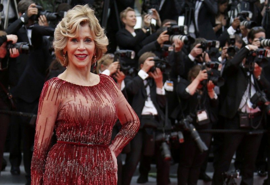 Actress Jane Fonda poses on the red carpet as she arrives for the opening ceremony of the 67th Cannes Film Festival in Cannes