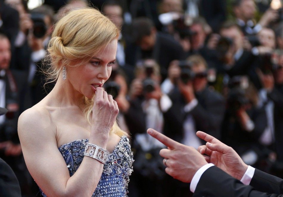 Cast member Nicole Kidman poses on the red carpet as she arrives for the opening ceremony and the screening of the film quotGrace of Monacoquot out of competition during the 67th Cannes Film Festival in Cannes