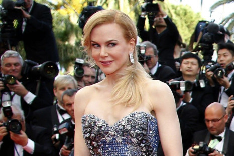 Cast member Nicole Kidman poses on the red carpet as she arrives for the opening ceremony and the screening of the film &quot;Grace of Monaco&quot; (Grace de Monaco) out of competition during the 67th Cannes Film Festival in Cannes May 14, 2014. 