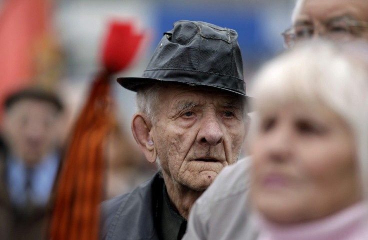 An elderly man takes part in a rally to commemorate International Workers' Day, or Labour Day, in Luhansk, eastern Ukraine, May 1, 2014. REUTERS/Vasily Fedosenko